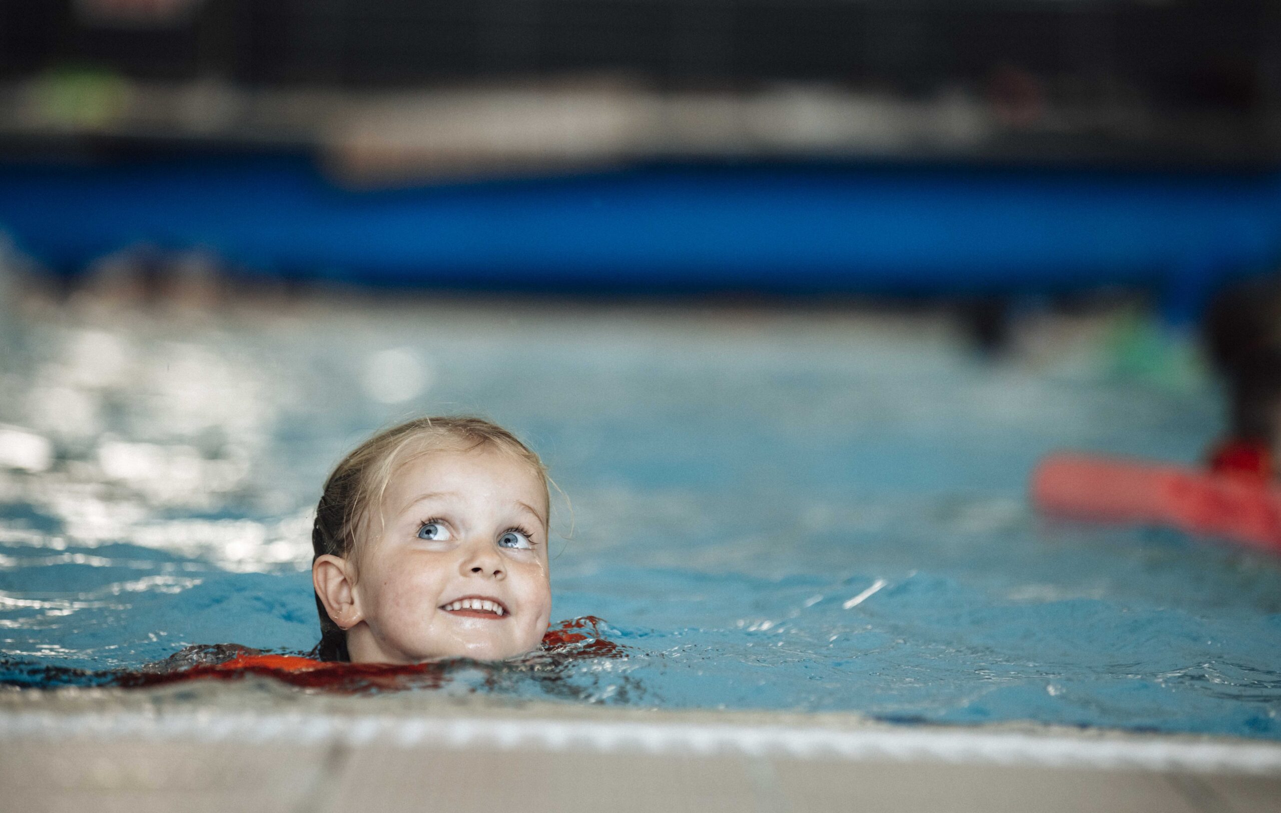 a child swimming in the pool