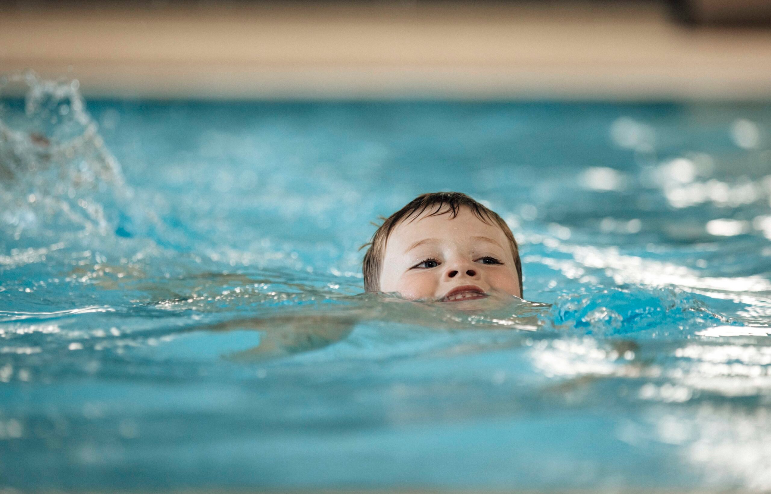 boy swimming in the pool
