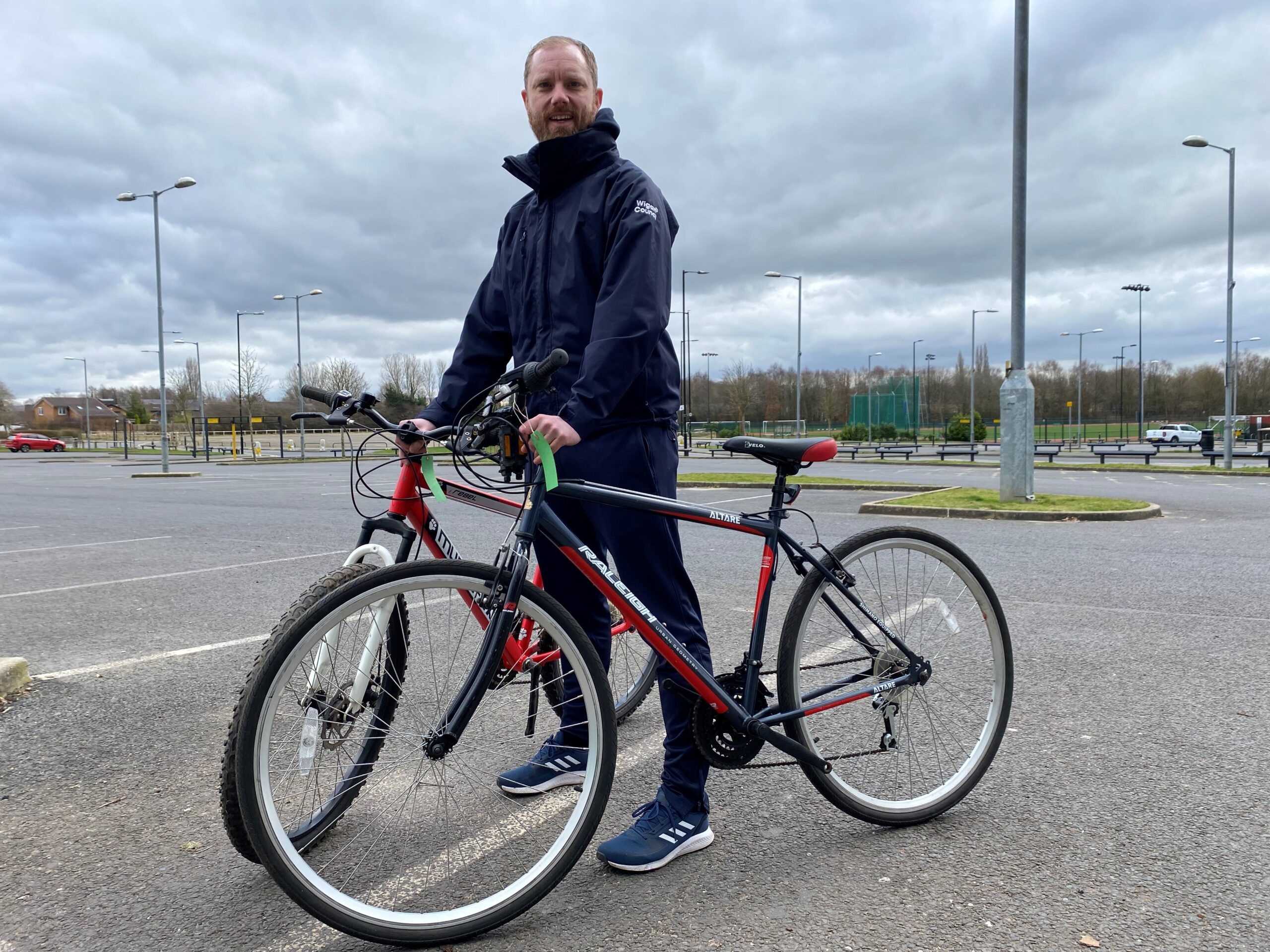 A member of staff with two bikes