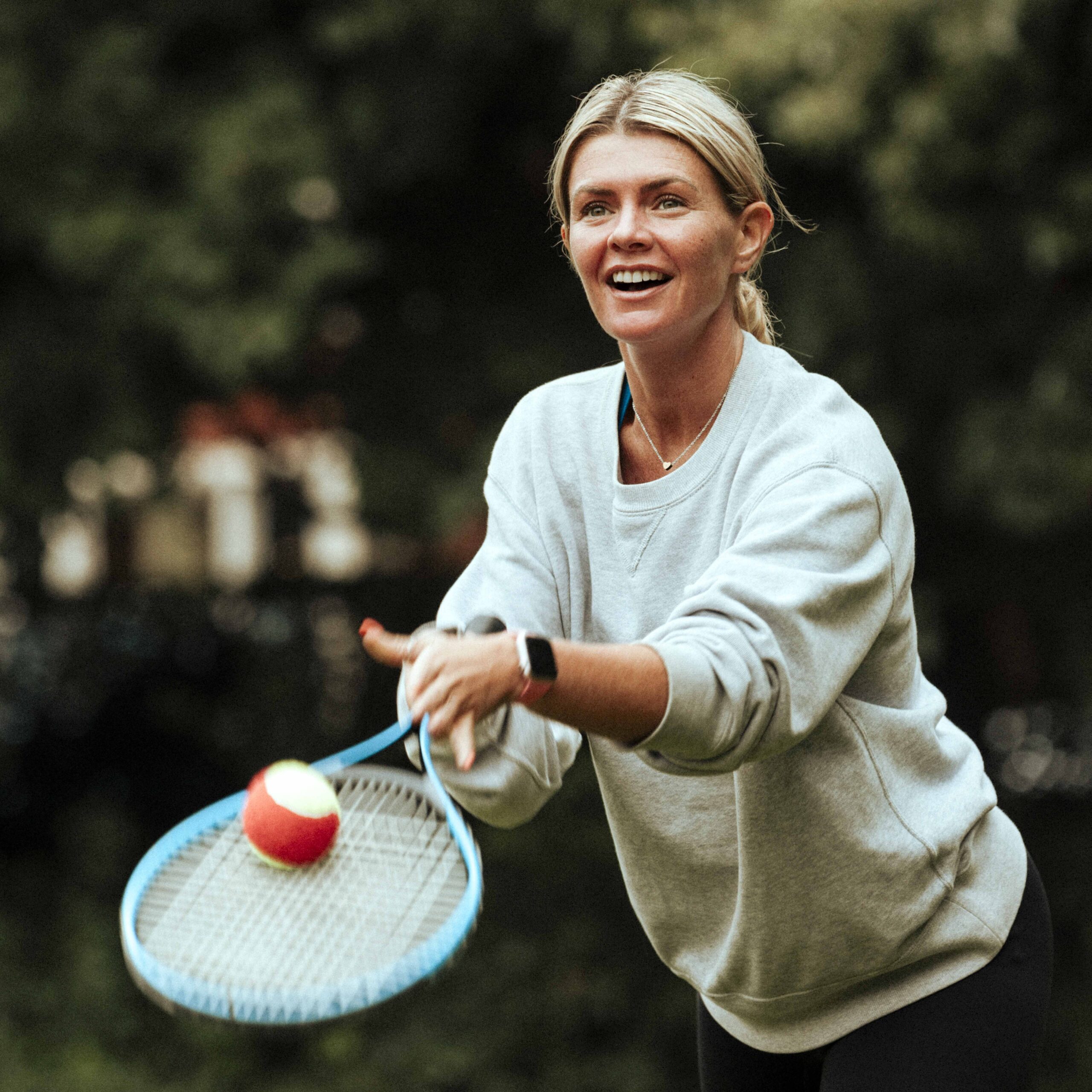 Woman playing tennis at the park