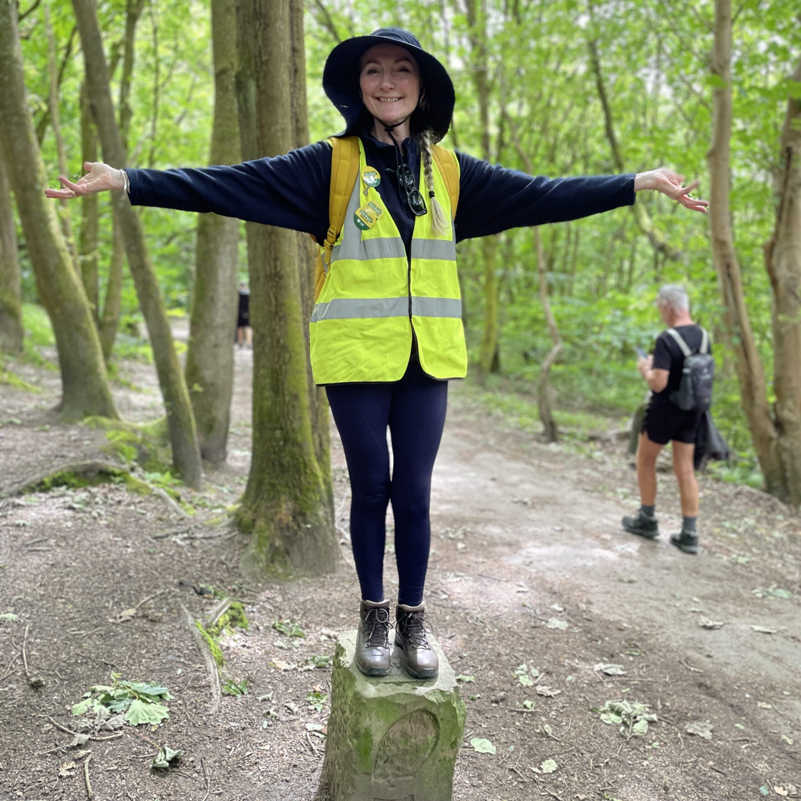 Bev standing on a Wigan Way waymarker