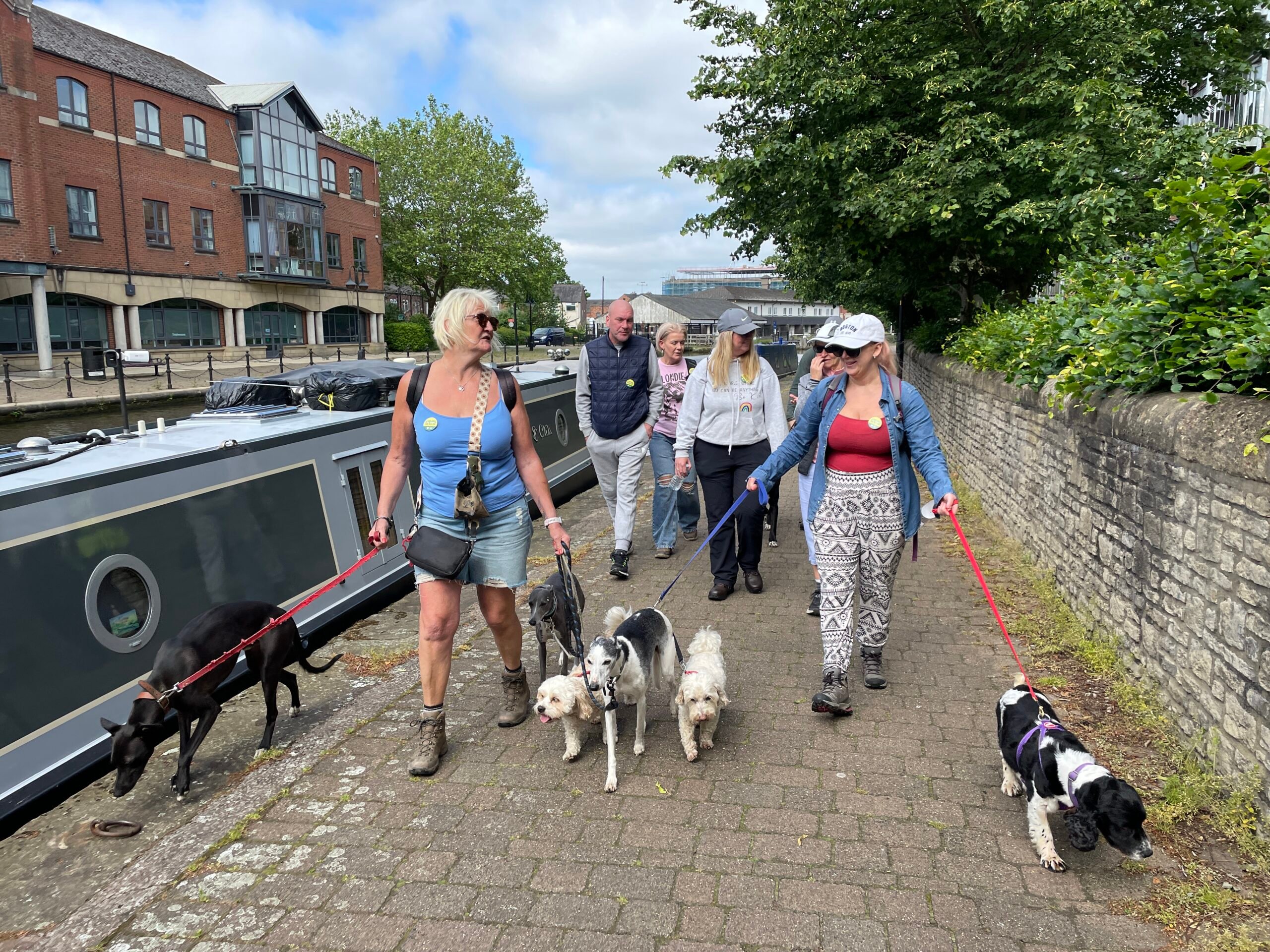 A group of walkers on the Leeds-Liverpool Canal towpath