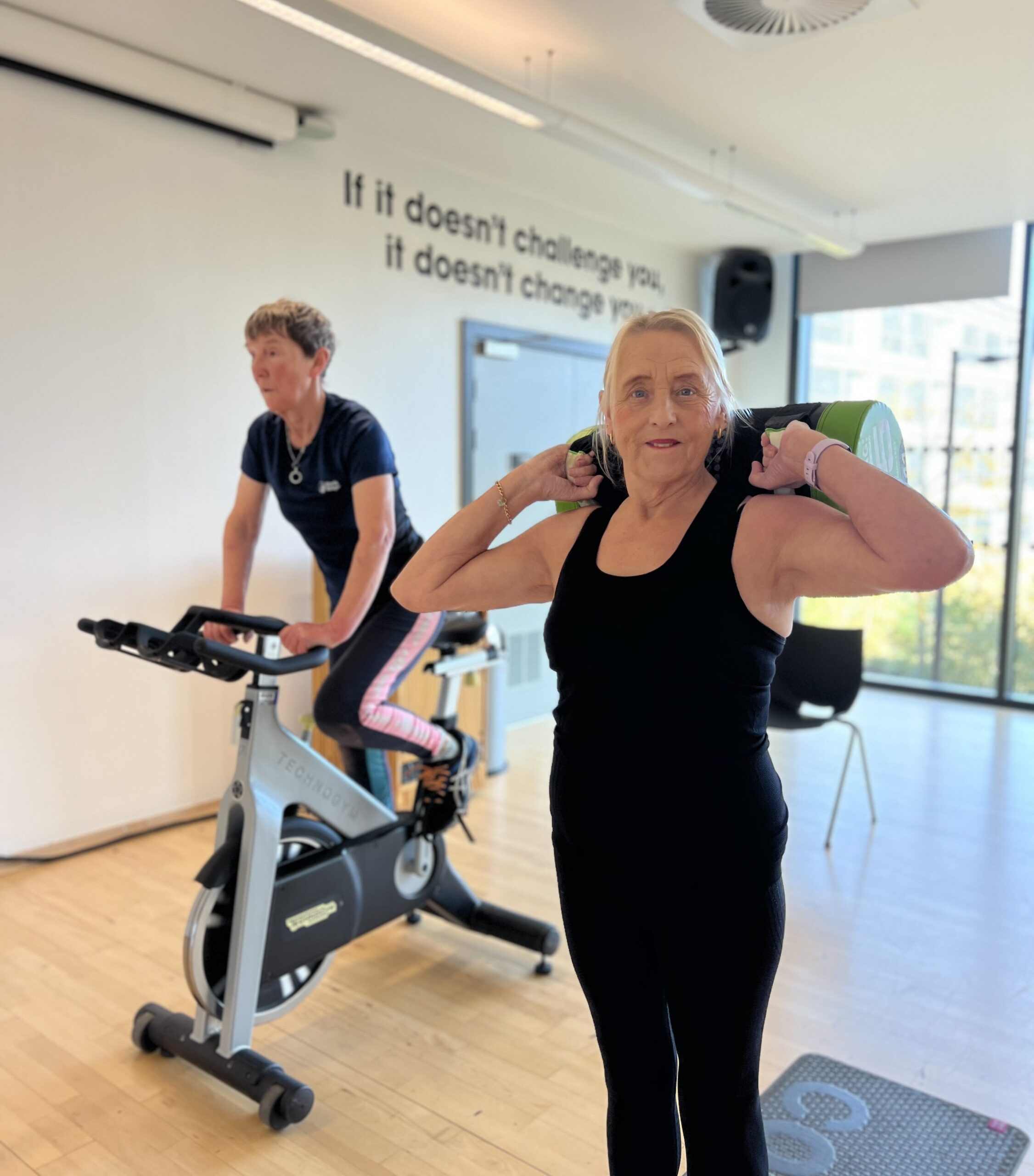 Two women at a group exercise class