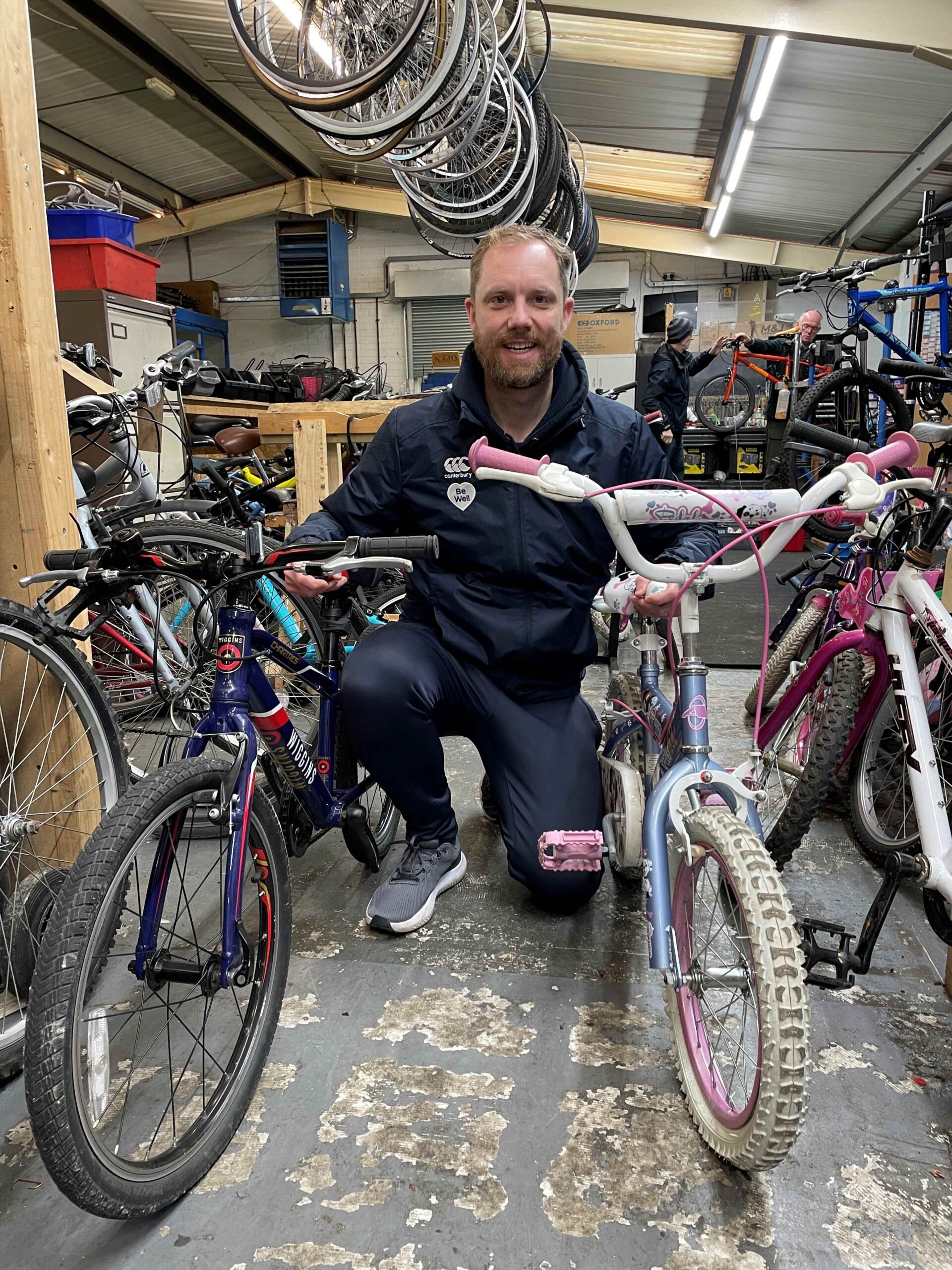 A member of staff with two bikes