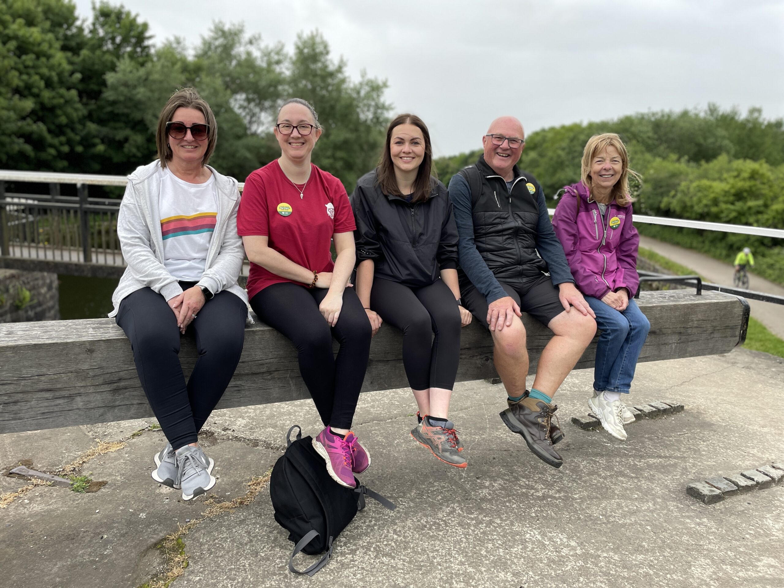 A group of walkers at a canal lock