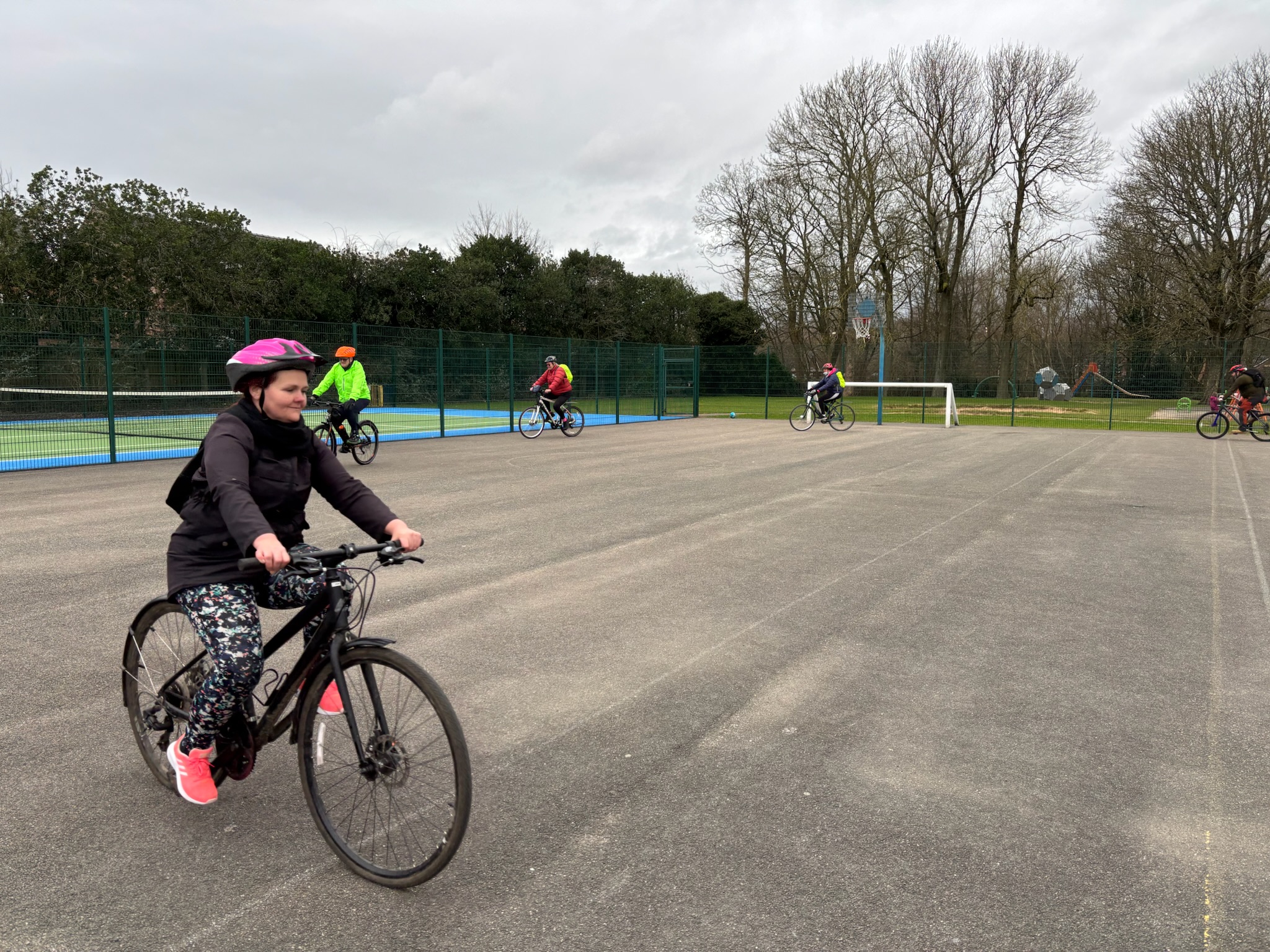 Adults learning to ride a bike