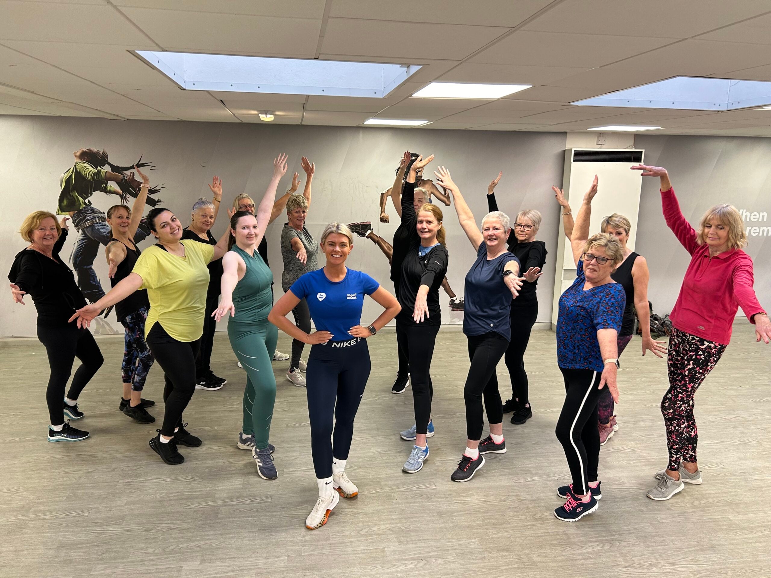 Danielle and a group of dancers strike a pose