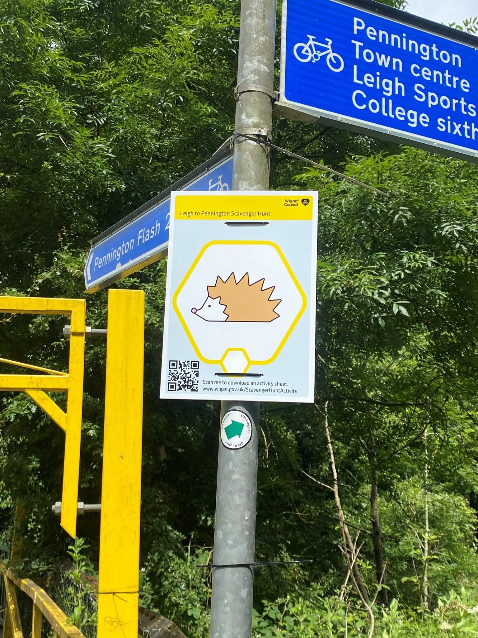 A Scavenger Hunt sign featuring a cartoon hedgehog attached to a signpost